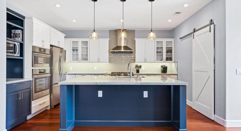 Kitchen remodel: island counter top, overhead lighting and appliances.