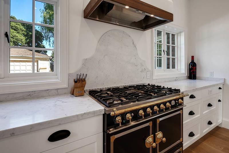 remodeled kitchen with marble countertops