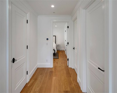 restored hardwood flooring in a historical home remodel 