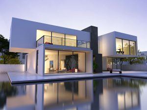 Two Story White Modern Style Architecture home with large windows and a patio in front of a pool of water. 