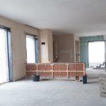 Office building with tenant improvements in progress, building short, divider wall.