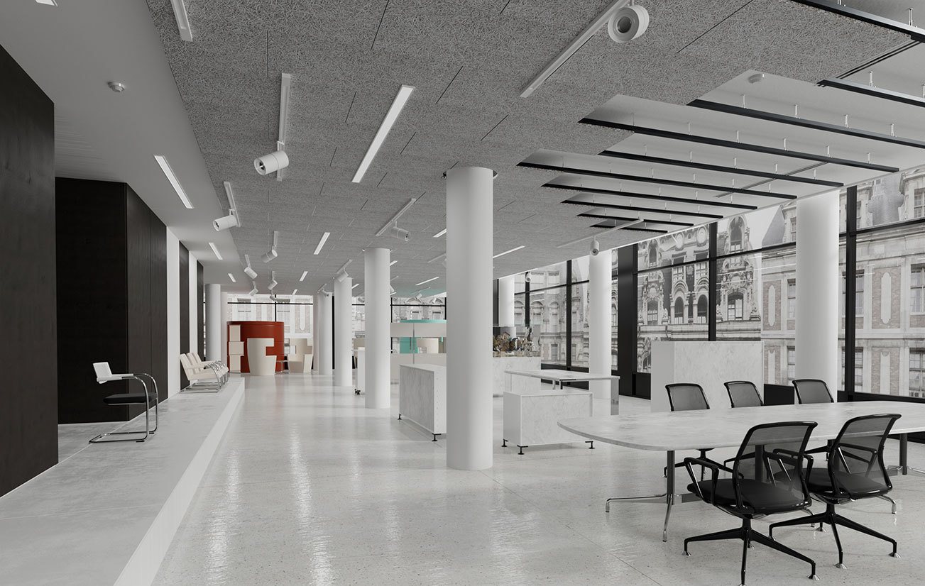 Large white room with many round white pillars and acoustic panels in parts of the ceiling.